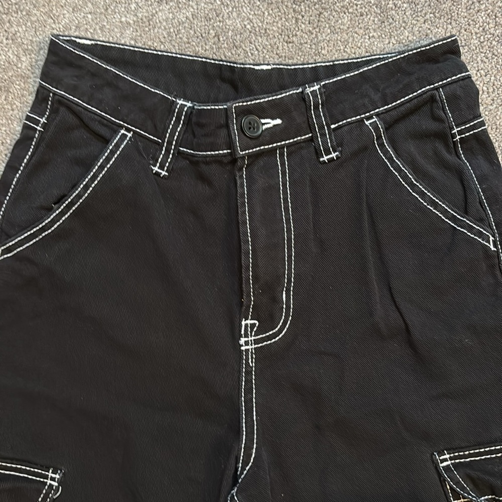 Divided black pants with white stitch detail